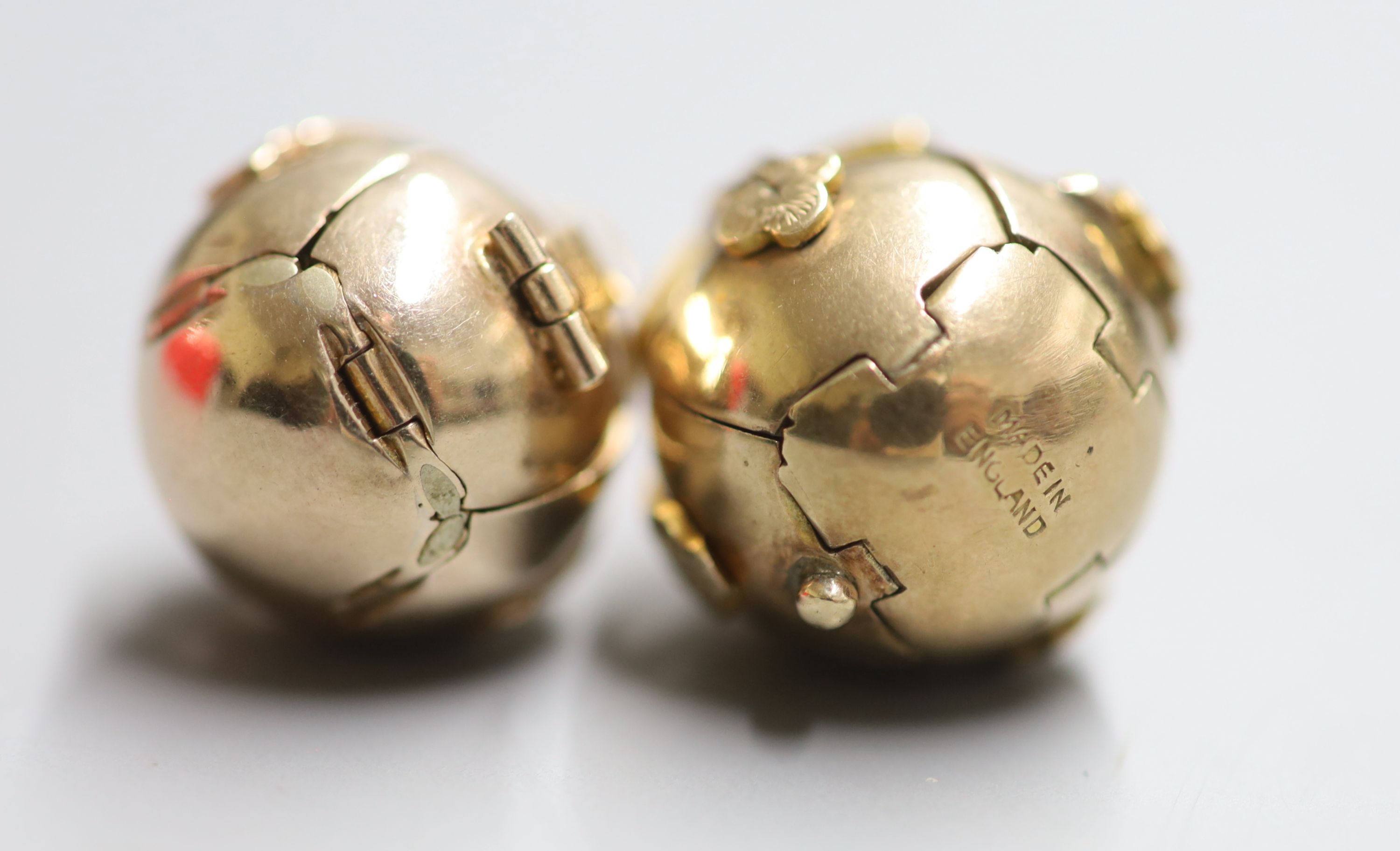 Two yellow and white metal masonic ball pendants, largest diameter 18mm, gross 20.5 grams.